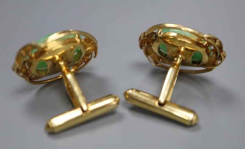 A pair of 585 yellow metal and oval cabochon jade set cufflinks, gross 12.2 grams,